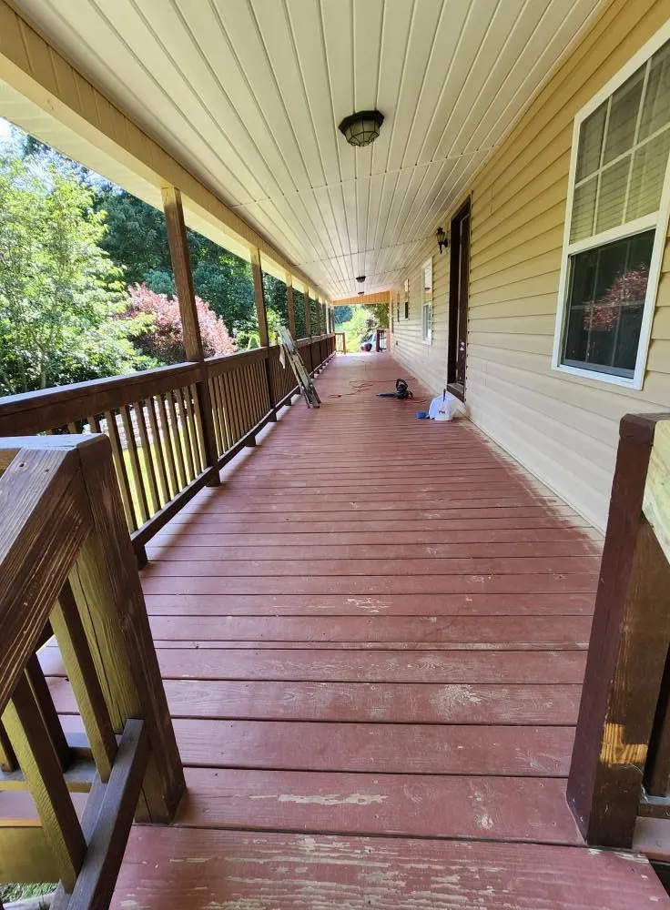 Freshly painted covered porch and red deck near Swannanoa NC