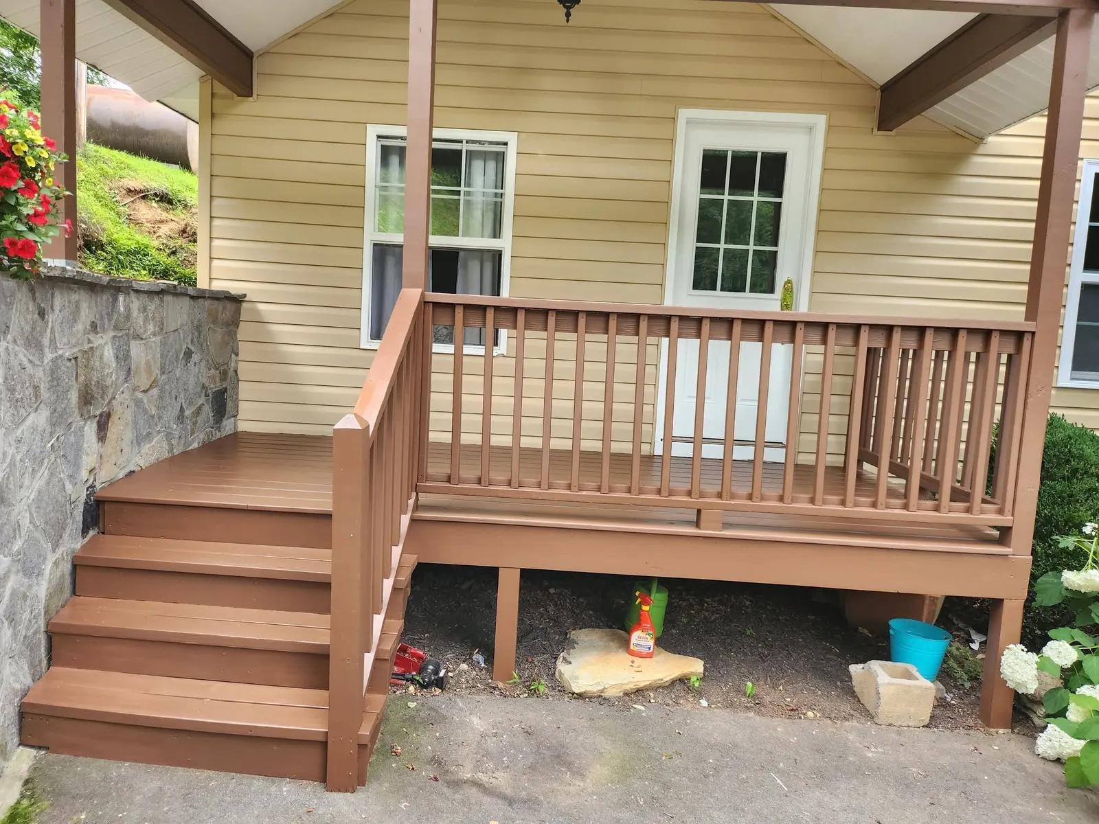 Finished covered porch and deck after an exterior painting project