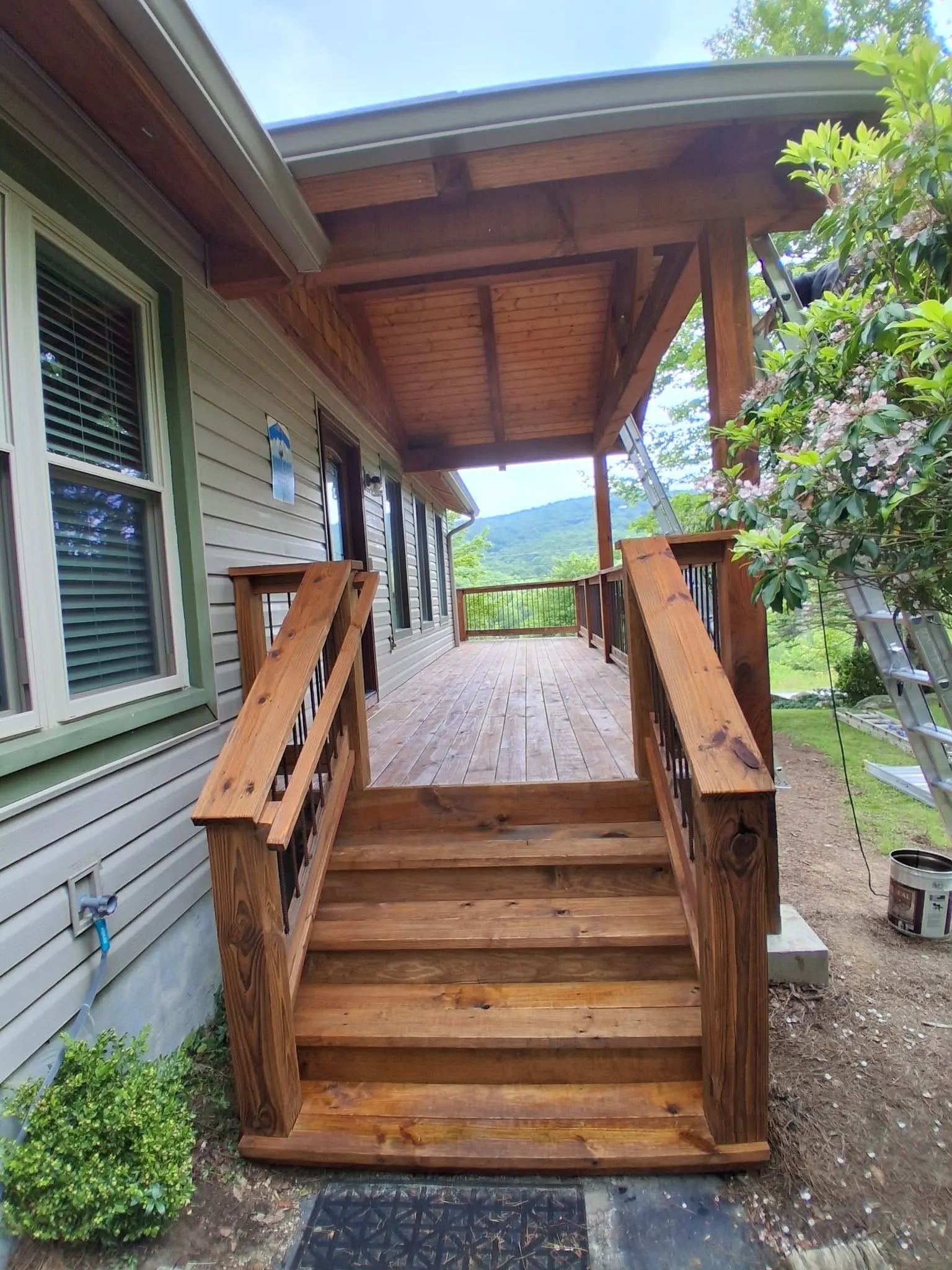 Freshly stained deck and railing after a deck staining project