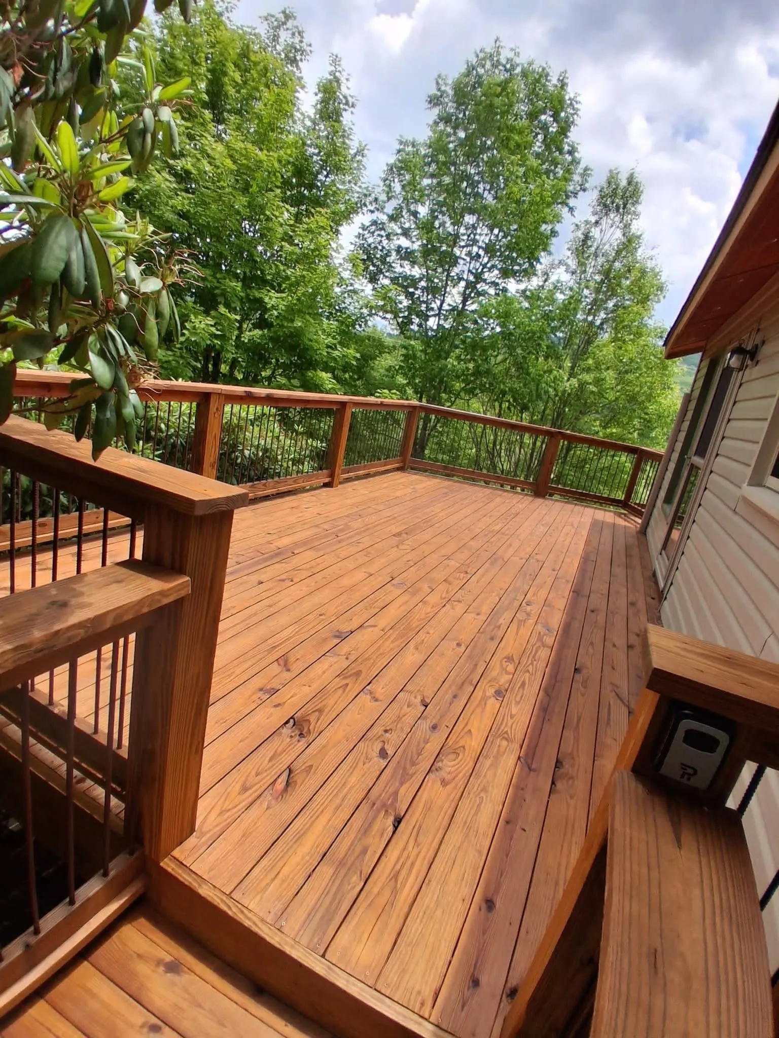 Finished stained deck corner after a deck staining project