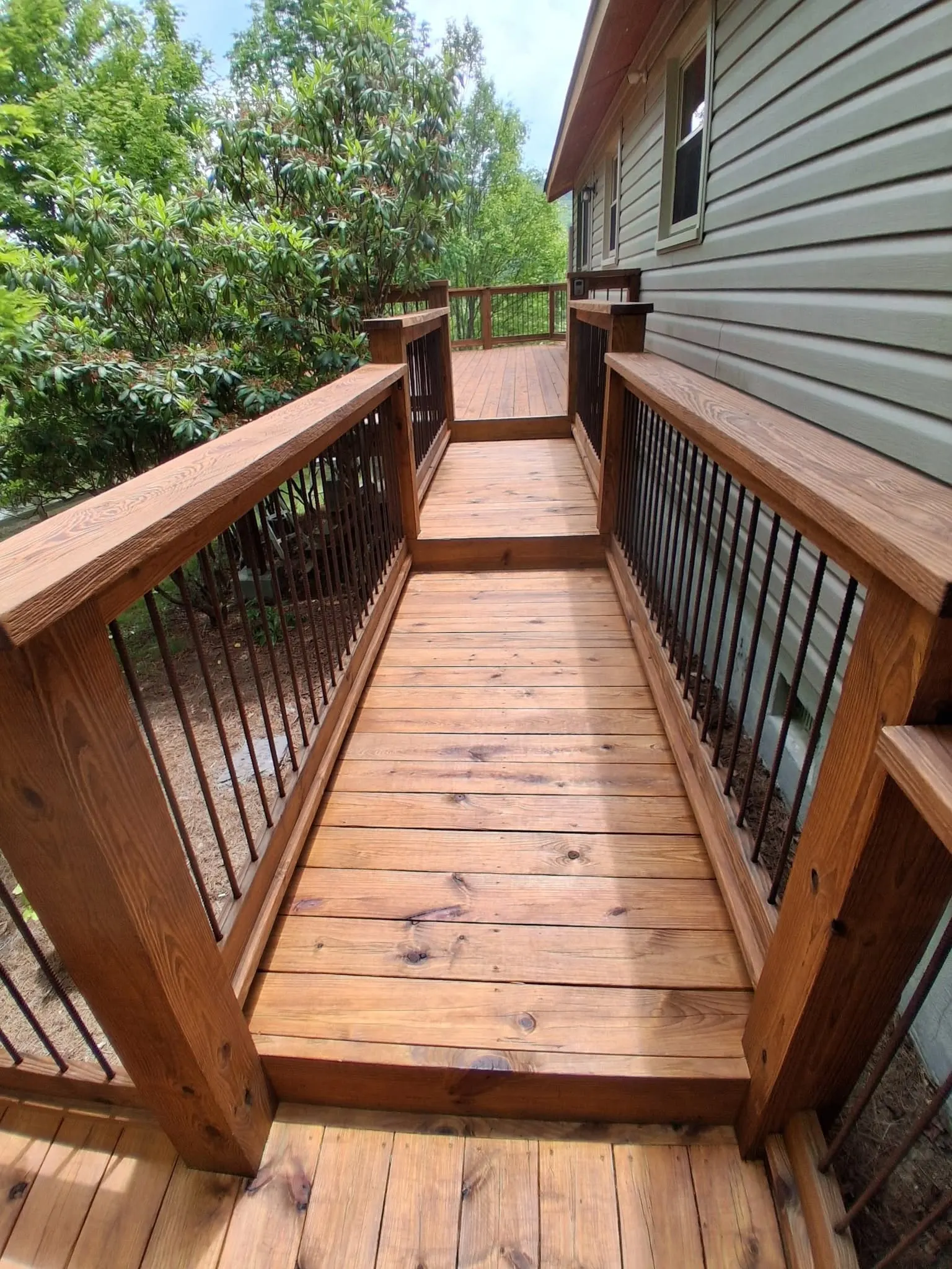 Finished stained deck stairs and entry after a deck staining project