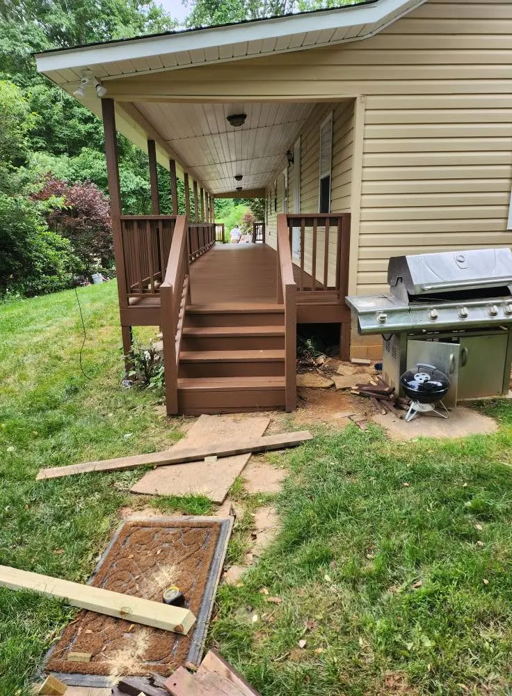 Wraparound deck and stairs before painting on a home near Swannanoa NC