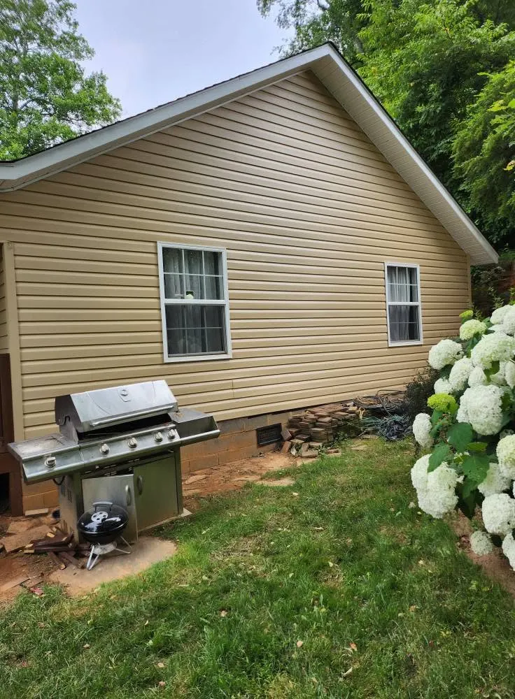 Finished tan exterior siding after a repaint near Swannanoa NC