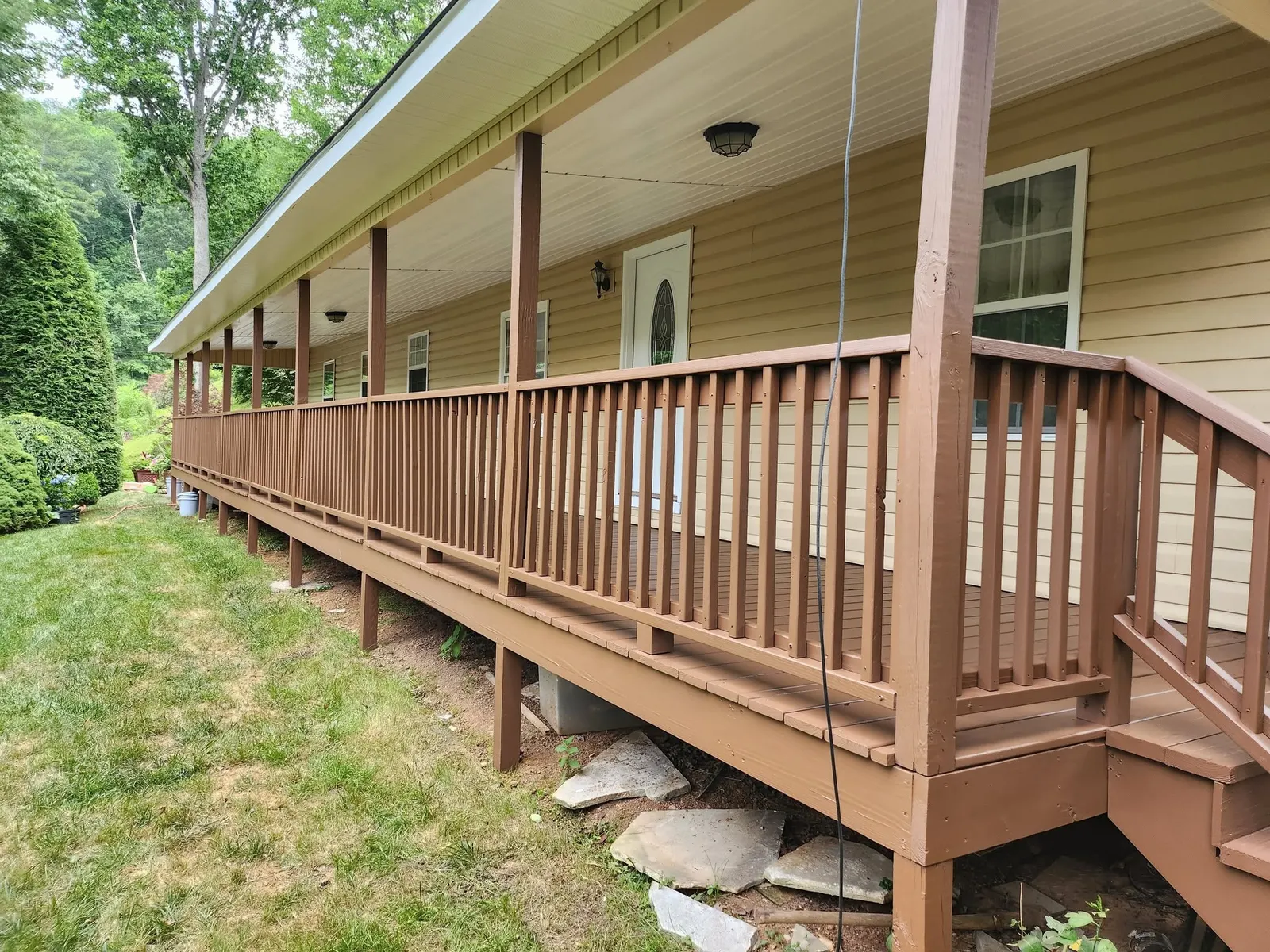 Finished exterior porch railing after a repaint near Swannanoa NC